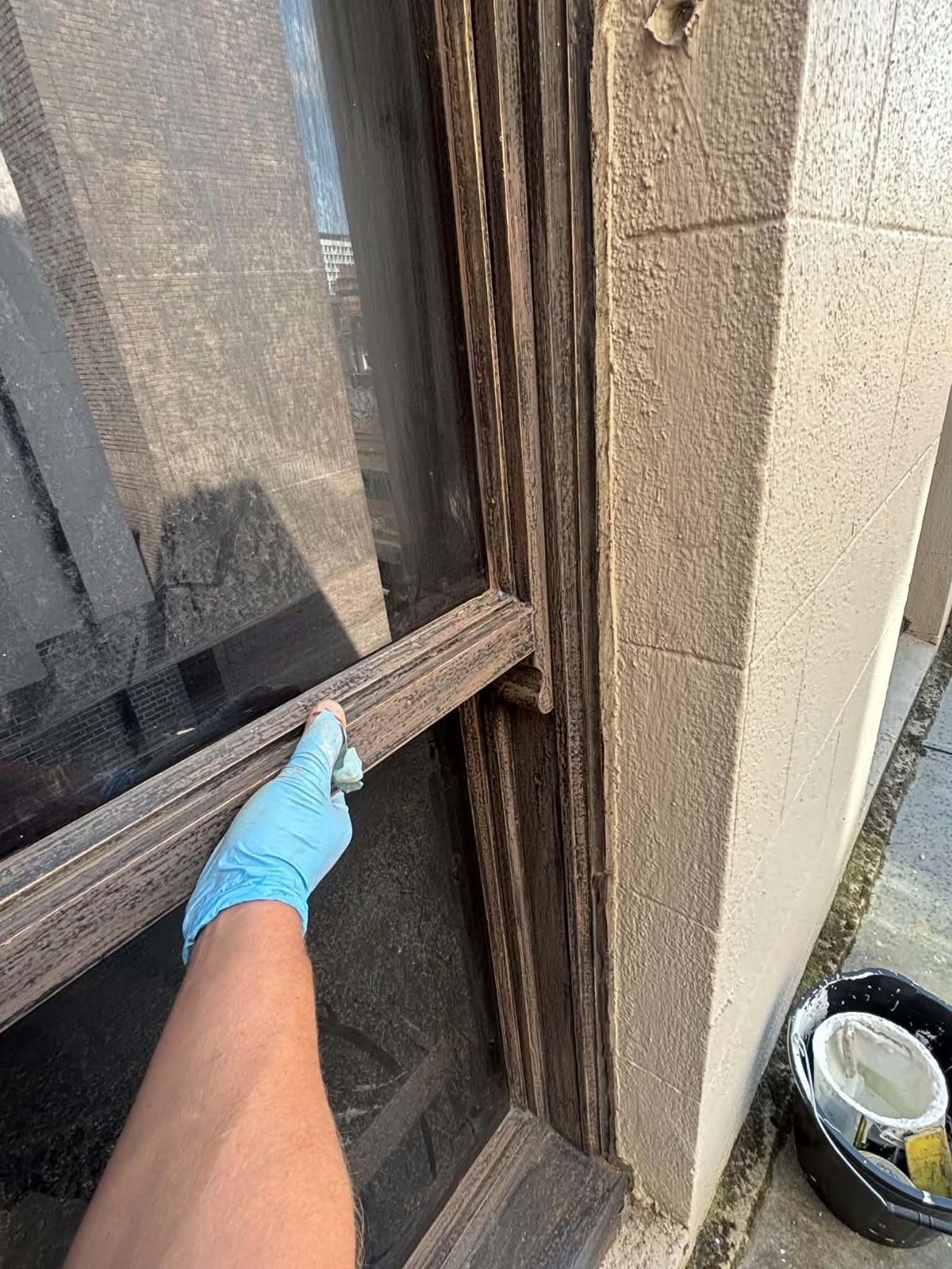 Preparation work on an external timber window frame before repainting